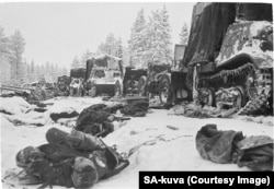 Dead Soviet soldiers lie in the aftermath of a devastating attack on a Soviet column on the Raate Road in January 1940.