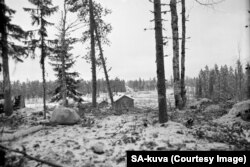 Soviet tanks (on road in background) advance into Finnish territory on December 17.