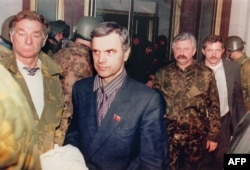 Former Supreme Soviet Chairman Ruslan Khasbulatov (second from left) and former Vice President Aleksandr Rutskoi (third from left) are arrested in Moscow on October 4, 1993.