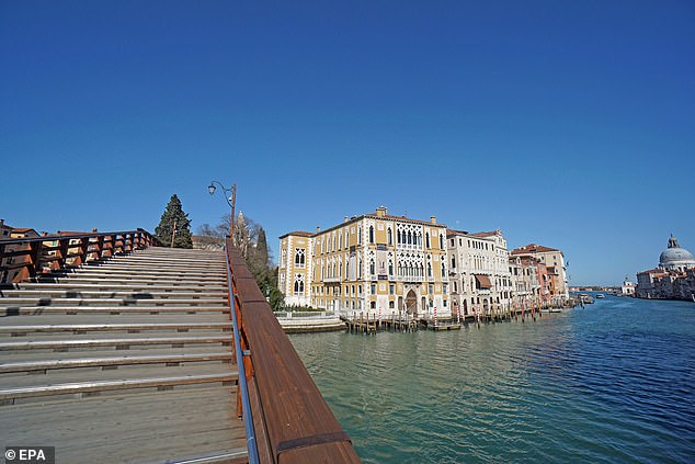 Pictured: Views of Grand Canal of Venice, with unusually clear water in the absence of wave motion, due to the blockage of traffic caused by the coronavirus emergency