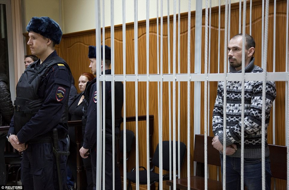 Alexander Nikitin, who was in charge of fire safety and the alarm system of the shopping mall, stands inside the defendants