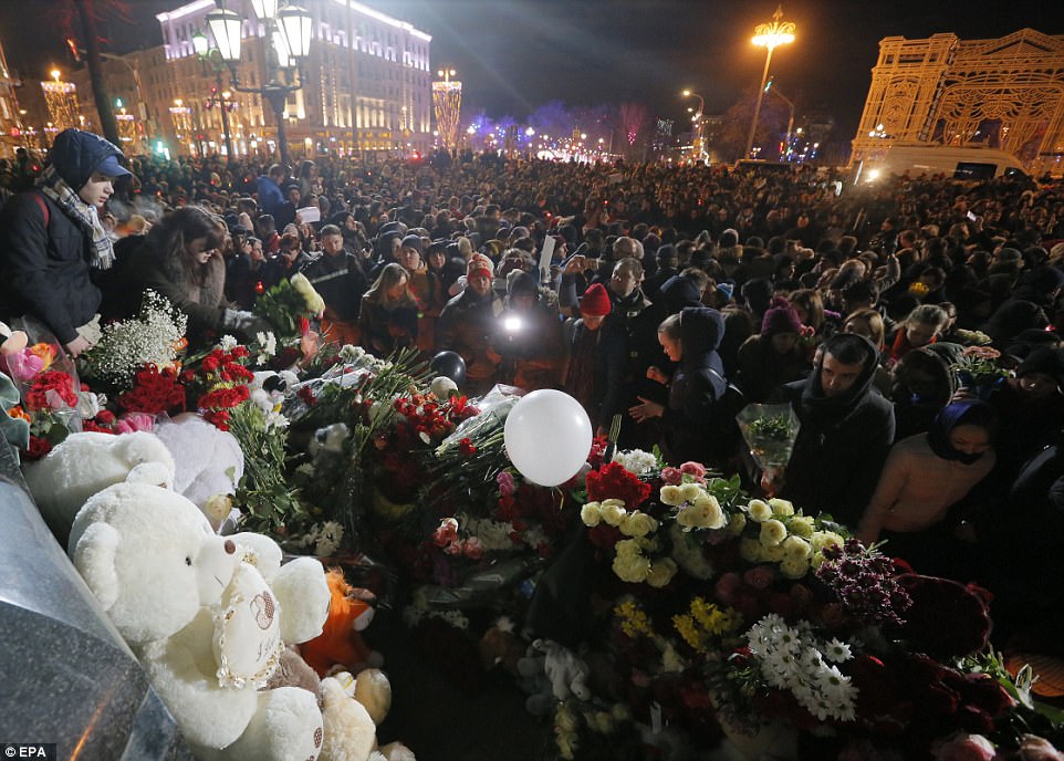 People attend a rally organized via social networks, in memory of victims of a fire in the Kemerovo