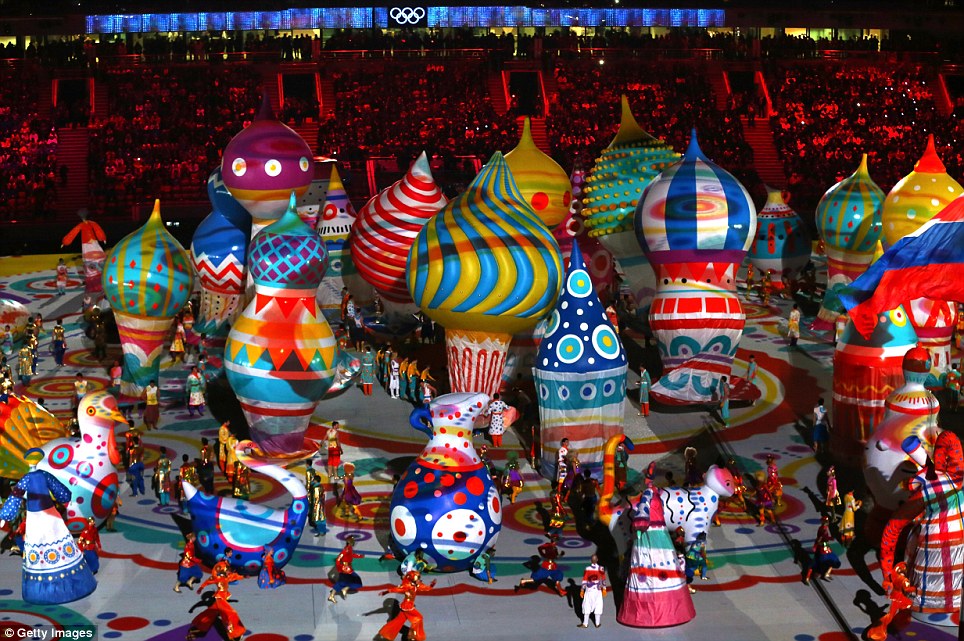 Inflated opinion! Artists perform during the ceremony in front of huge air-filled Russian buildings
