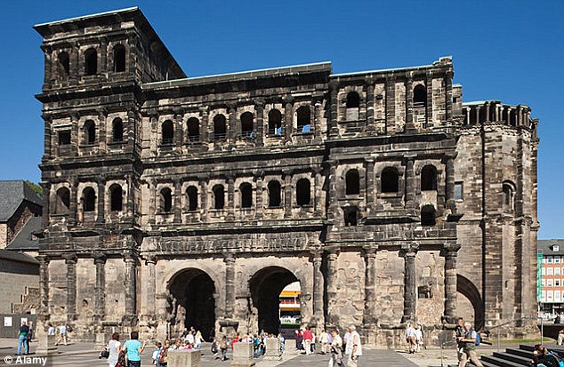 Roman gate: Porta Nigra is made of sandstone blocks sooty with age and held together with original iron clamps
